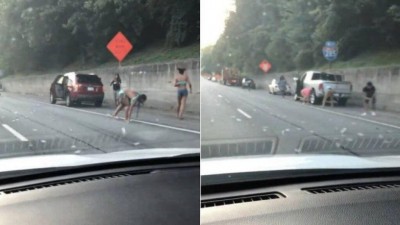 Pessoas correm atrás de dólares caídos em rodovia (Foto: Reprodução)