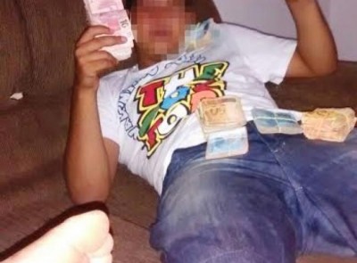 Estudante que ostentava dinheiro nas redes sociais é apreendido com arma