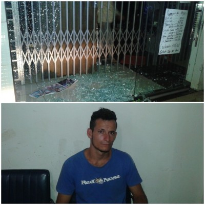 Vidraça da loja quebrada e o acusado (Foto: Sidnei Bronka) ()